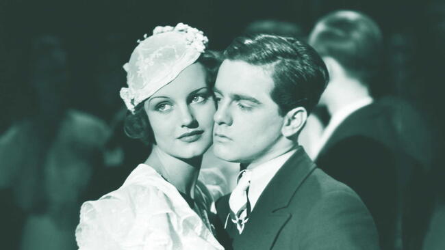 couple dancing, women in white dress and hat, man in black suit and tie. vintage sadie hawkins day dance