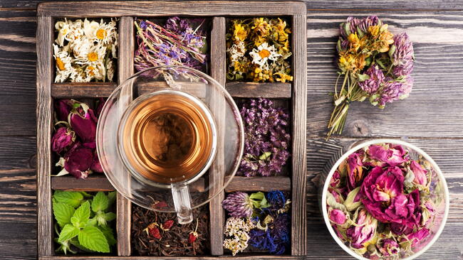 Dried herbal teas in a portioned wooden container