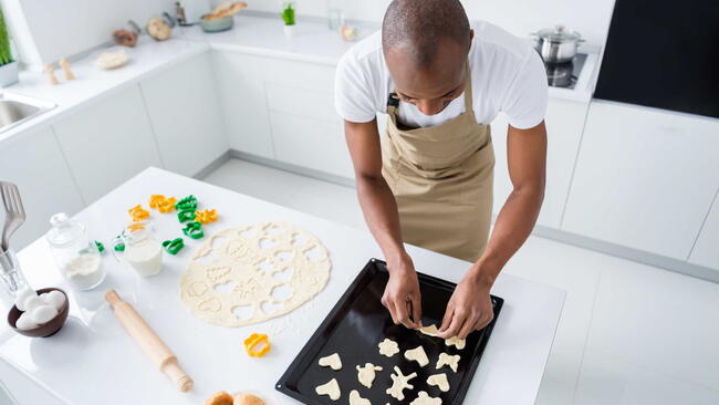 Top above high angle view of his he nice attractive guy preparing craft handmade handicraft snack pie cake cookies learning courses in modern light white interior house kitchen. baking cookies, sugar cookies, rolling pin, cookie sheet